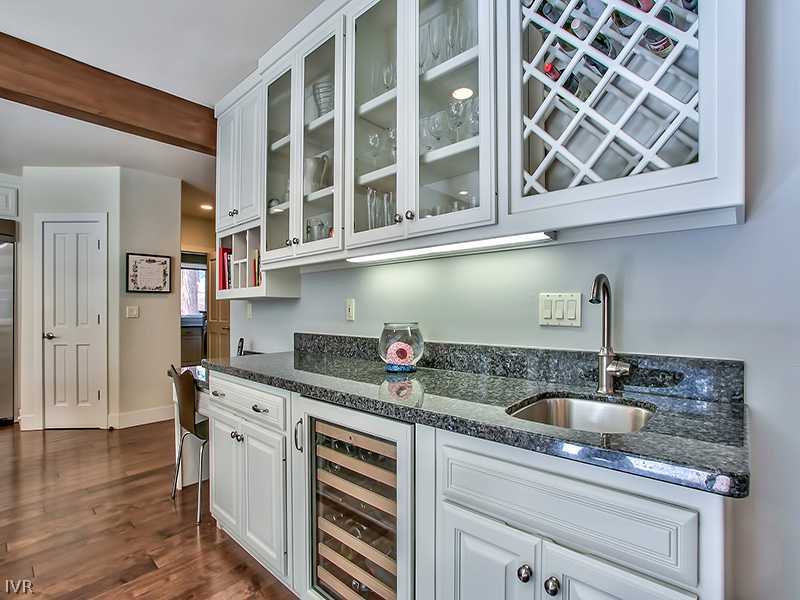 818 Ophir Peak Road Incline Village, NV 89451 - Photo 10 of 31 a kitchen with stainless steel appliances granite countertop a sink and cabinets