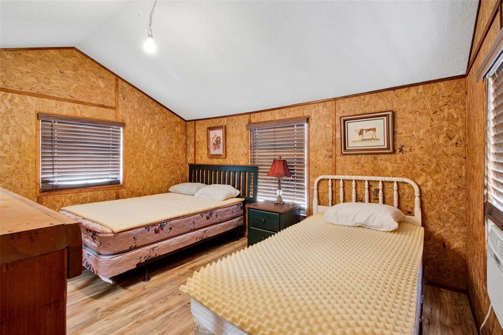 4185 Rock Creek Road Whitesboro, TX 76273 - Photo 18 of 18 Bedroom featuring wood finished floors