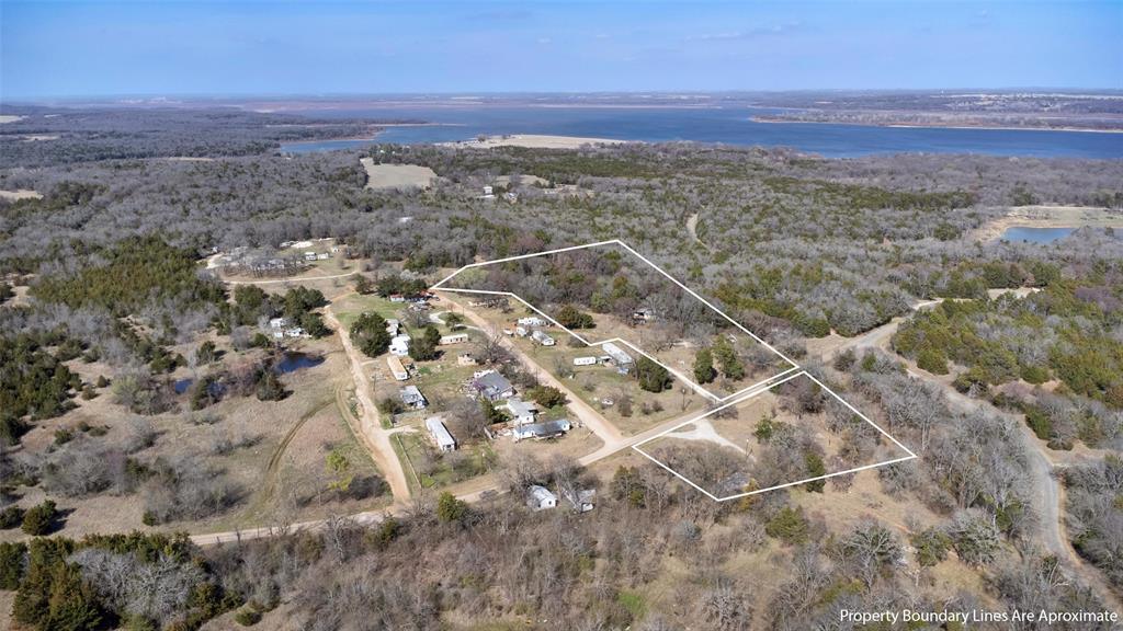 4185 Rock Creek Road Whitesboro, TX 76273 - Photo 10 of 18 Aerial view of property's location featuring a large body of water and property boundaries highlighted