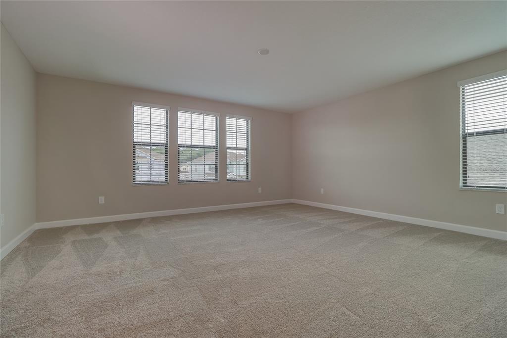1172 Montgomery Bell Road Wesley Chapel, FL 33543 - Photo 18 of 47 an empty room with windows