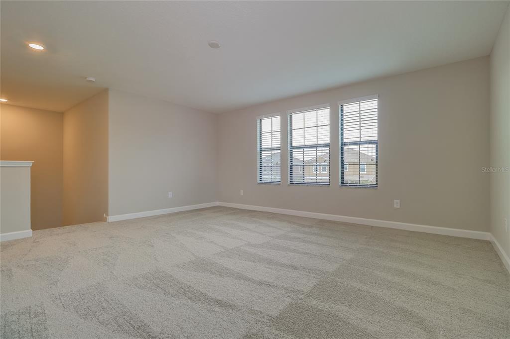 1172 Montgomery Bell Road Wesley Chapel, FL 33543 - Photo 19 of 47 an empty room with windows