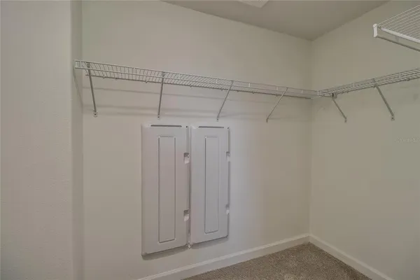 a view of a room with racks on the wall