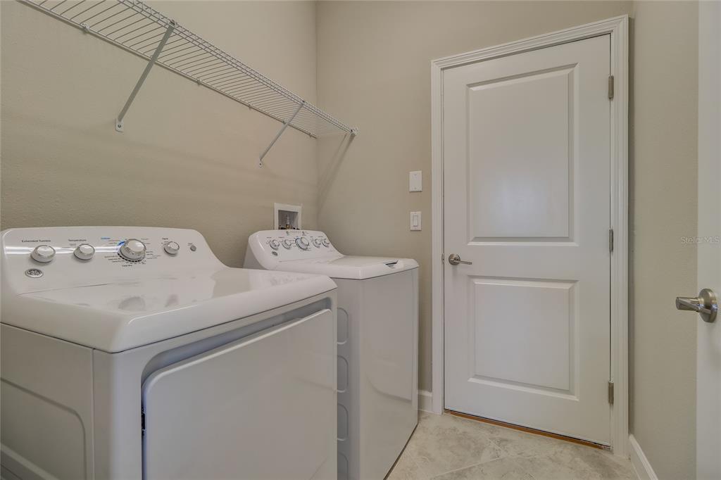 1172 Montgomery Bell Road Wesley Chapel, FL 33543 - Photo 32 of 47 a utility room with dryer and washer