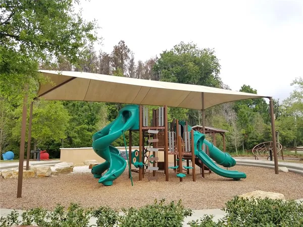 a swimming pool with outdoor seating and yard