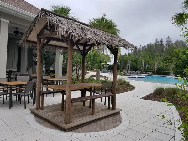 a view of a patio with two chairs and a table