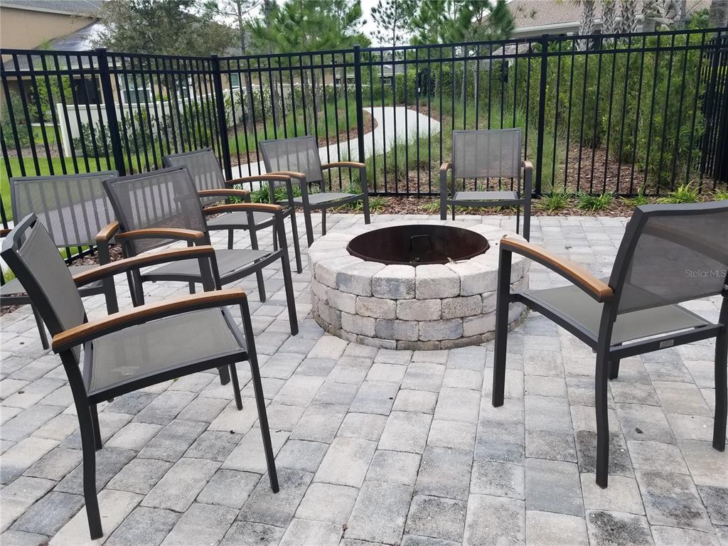 1172 Montgomery Bell Road Wesley Chapel, FL 33543 - Photo 45 of 47 a view of a patio with two chairs and a table