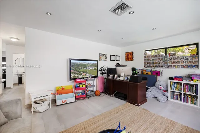 an aerial view of a house with a yard and a garage