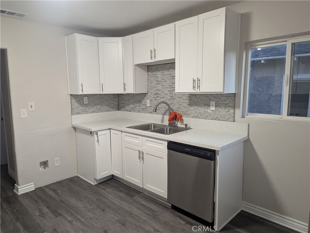 12001 Vivienda Avenue Grand Terrace, CA 92313 - Photo 2 of 7 a kitchen with a sink and cabinets