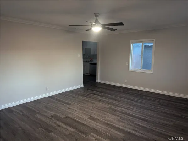 a view of empty room with wooden walls