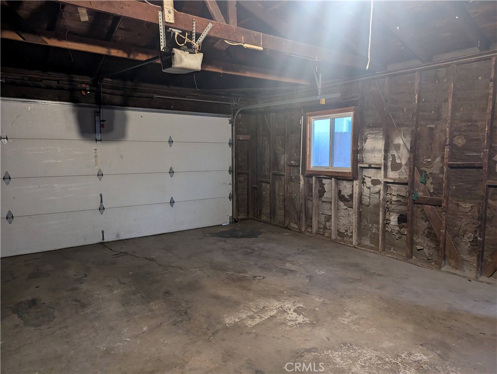 12001 Vivienda Avenue Grand Terrace, CA 92313 - Photo 6 of 7 a view of empty room with wooden walls