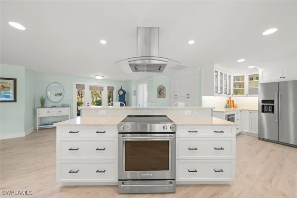 a kitchen with granite countertop a stove and a sink