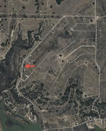 a aerial view of a house with a yard