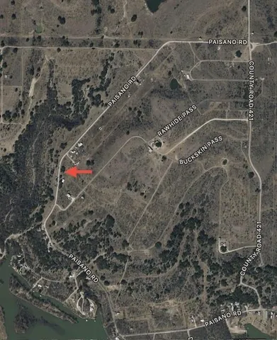 a aerial view of a house with a yard