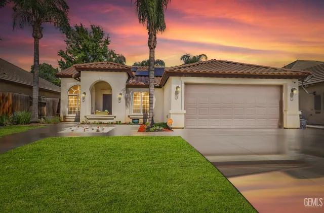 a front view of a house with yard porch and furniture