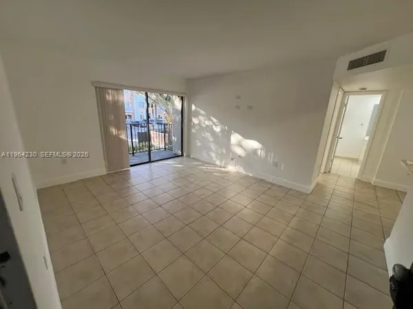 a view of an empty room and window