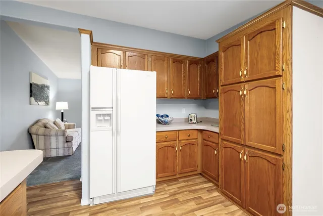 a kitchen with stainless steel appliances a stove a sink and a refrigerator