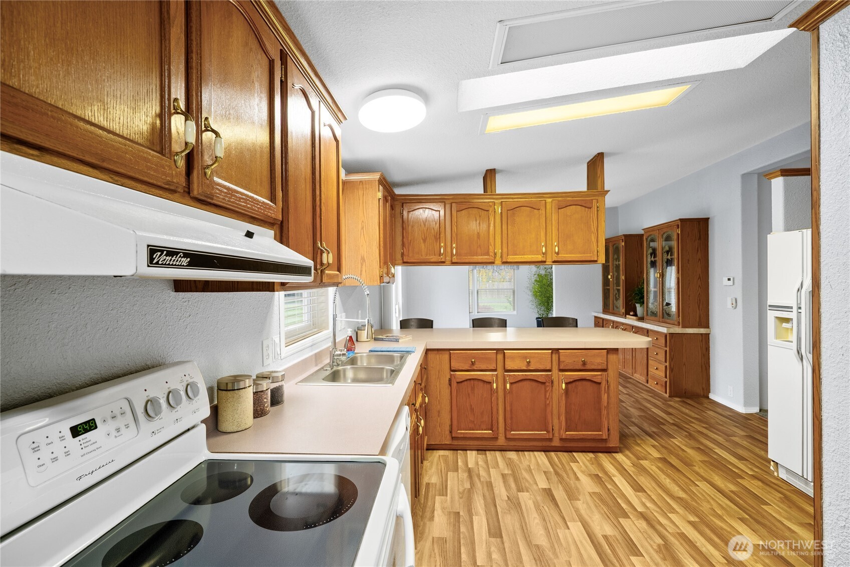 18000 Applegate Street Southwest Rochester, WA 98579 - Photo 16 of 40 a kitchen with stainless steel appliances a stove a sink and a refrigerator