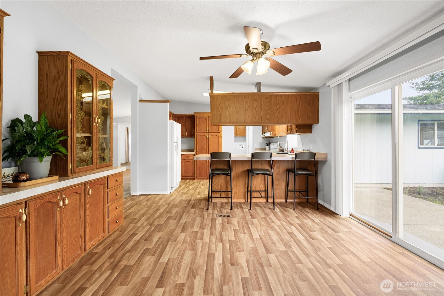 18000 Applegate Street Southwest Rochester, WA 98579 - Photo 21 of 40 a view of a kitchen with kitchen island wooden floor and stainless steel appliances