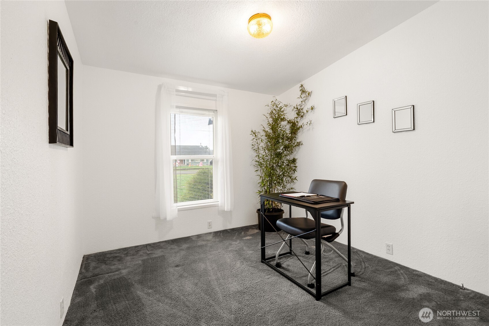 18000 Applegate Street Southwest Rochester, WA 98579 - Photo 27 of 40 a view of a workspace with furniture and a window