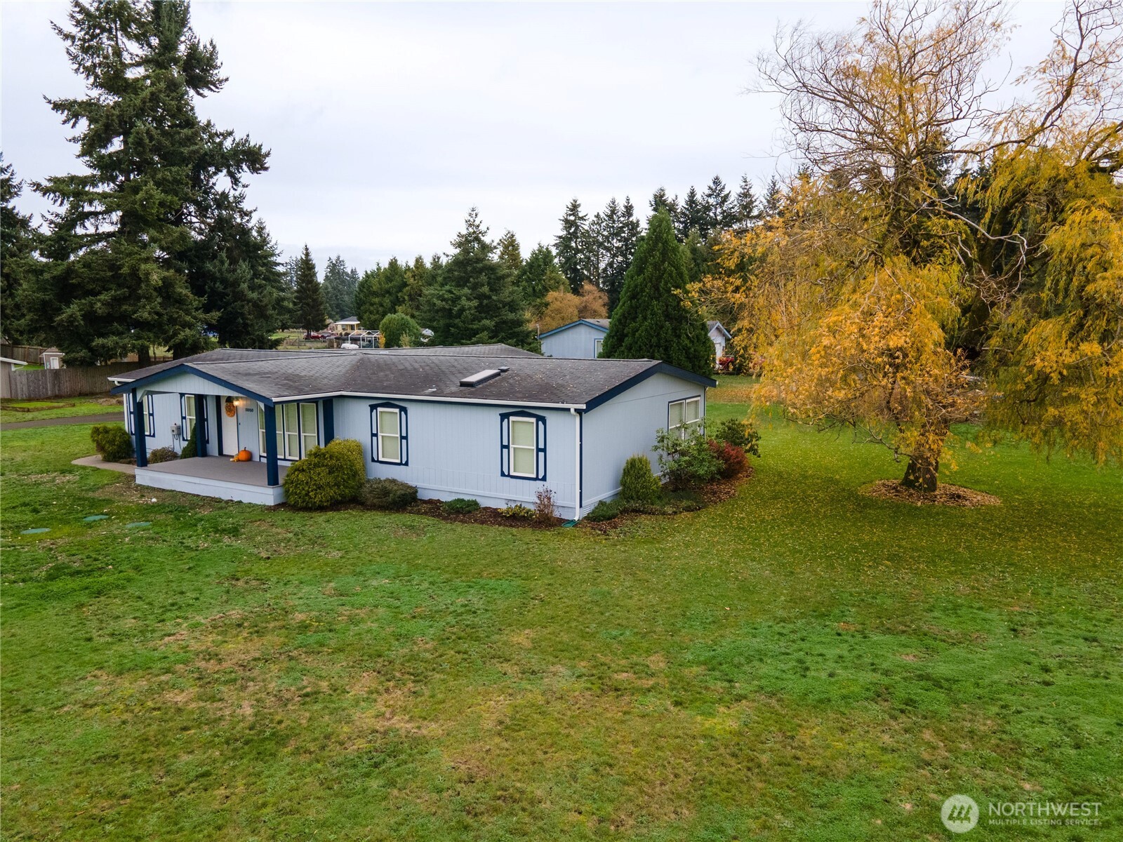 18000 Applegate Street Southwest Rochester, WA 98579 - Photo 3 of 40 a view of a house with a big yard plants and large trees