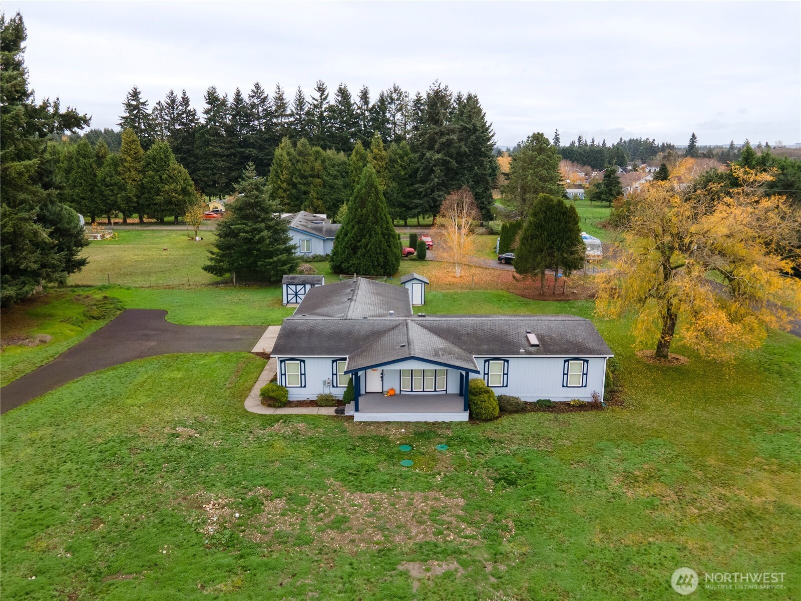 18000 Applegate Street Southwest Rochester, WA 98579 - Photo 37 of 40 a aerial view of a house with garden space and trees all around