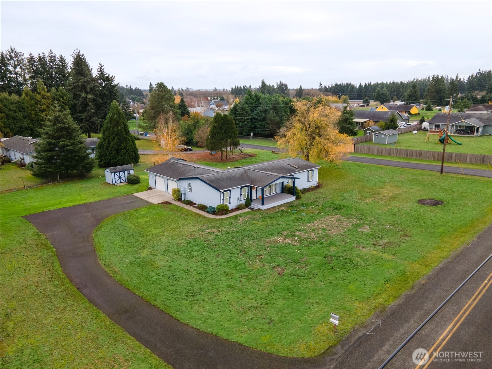 18000 Applegate Street Southwest Rochester, WA 98579 - Photo 38 of 40 an aerial view of a house with a garden and trees