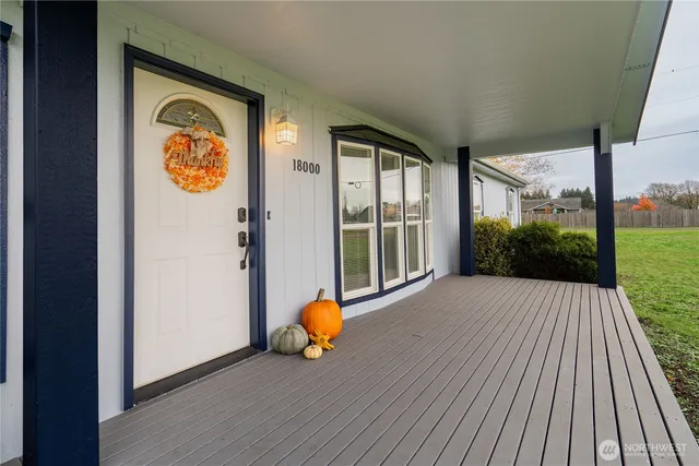 a view of a house with porch and wooden floor
