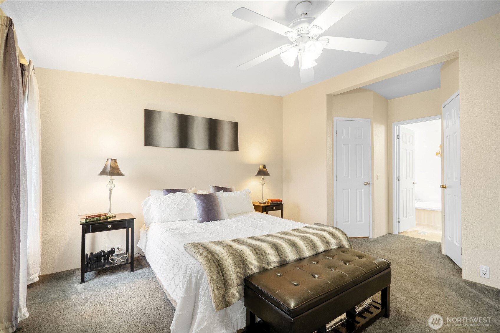 18000 Applegate Street Southwest Rochester, WA 98579 - Photo 8 of 40 a bedroom with a bed and a chandelier