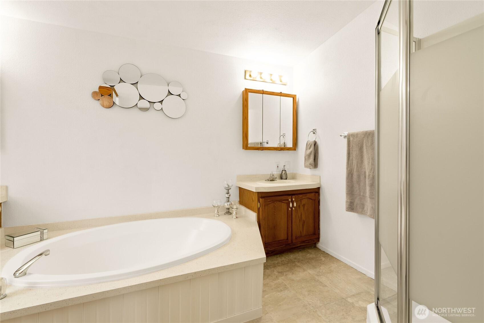 18000 Applegate Street Southwest Rochester, WA 98579 - Photo 10 of 40 a bathroom with a tub sink and mirror