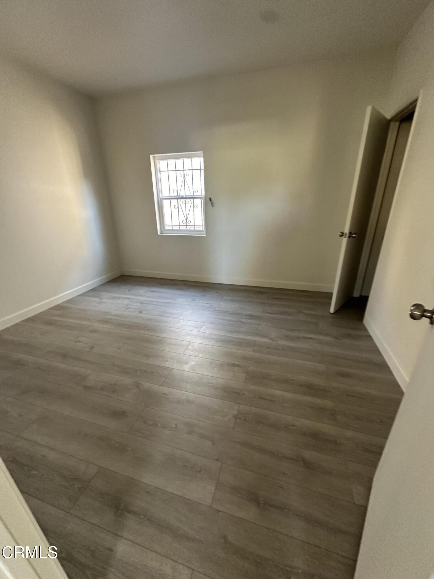 741 New Depot Street Los Angeles, CA 90012 - Photo 5 of 12 a view of an empty room with a window