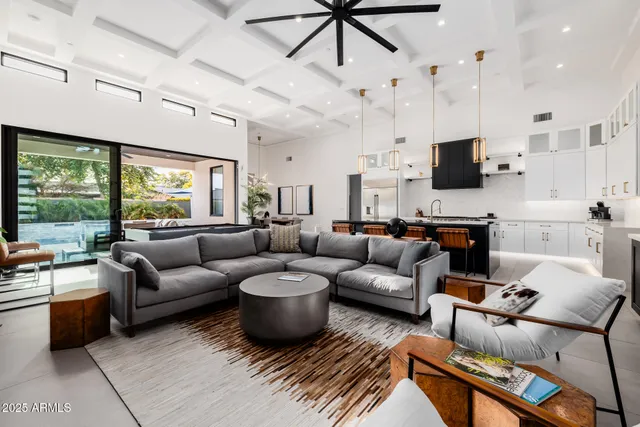 a dining room with furniture and a window