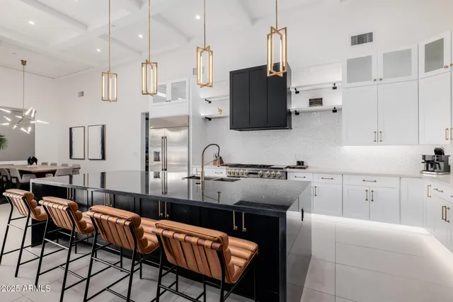 a bedroom with a large bed and a rug