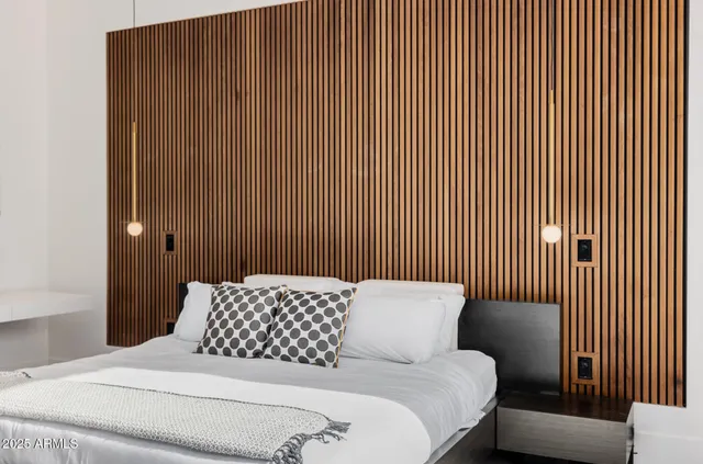 a white bath tub sitting next to a white toilet