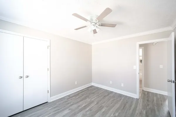 a bathroom with a sink mirror toilet and shower