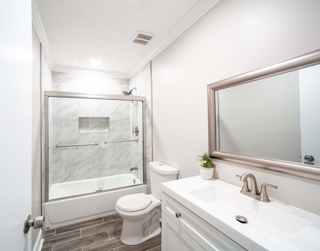 6308 Browning Drive Columbus, GA 31907 - Photo 12 of 19 a bathroom with a sink mirror toilet and shower