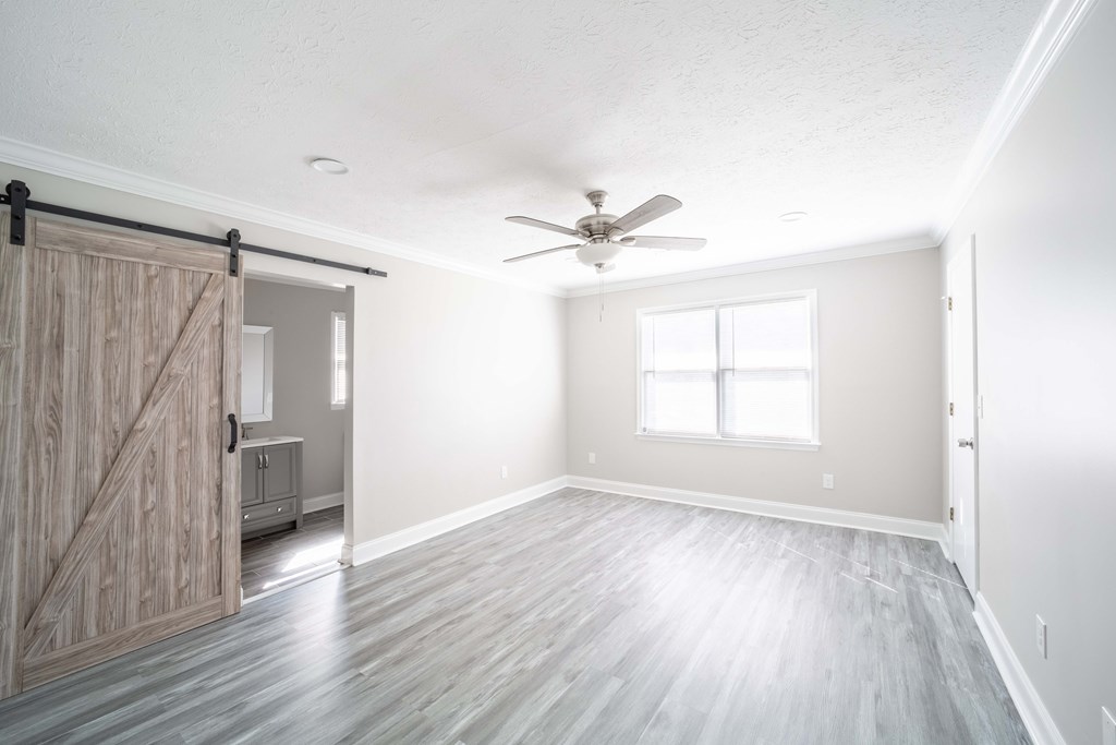 6308 Browning Drive Columbus, GA 31907 - Photo 13 of 19 a view of an empty room with a window and wooden floor