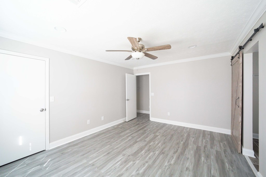 6308 Browning Drive Columbus, GA 31907 - Photo 14 of 19 an empty room with wooden floor and a ceiling fan