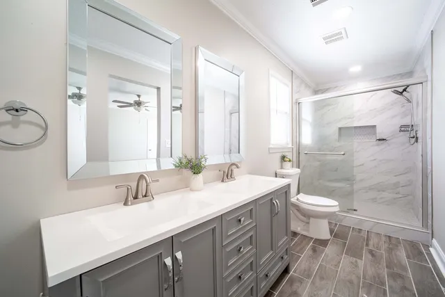 an empty room with wooden floor and window