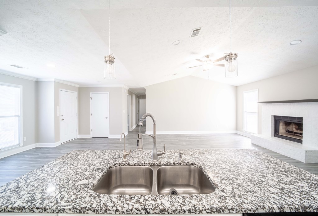6308 Browning Drive Columbus, GA 31907 - Photo 8 of 19 a kitchen with a sink cabinets and a fireplace