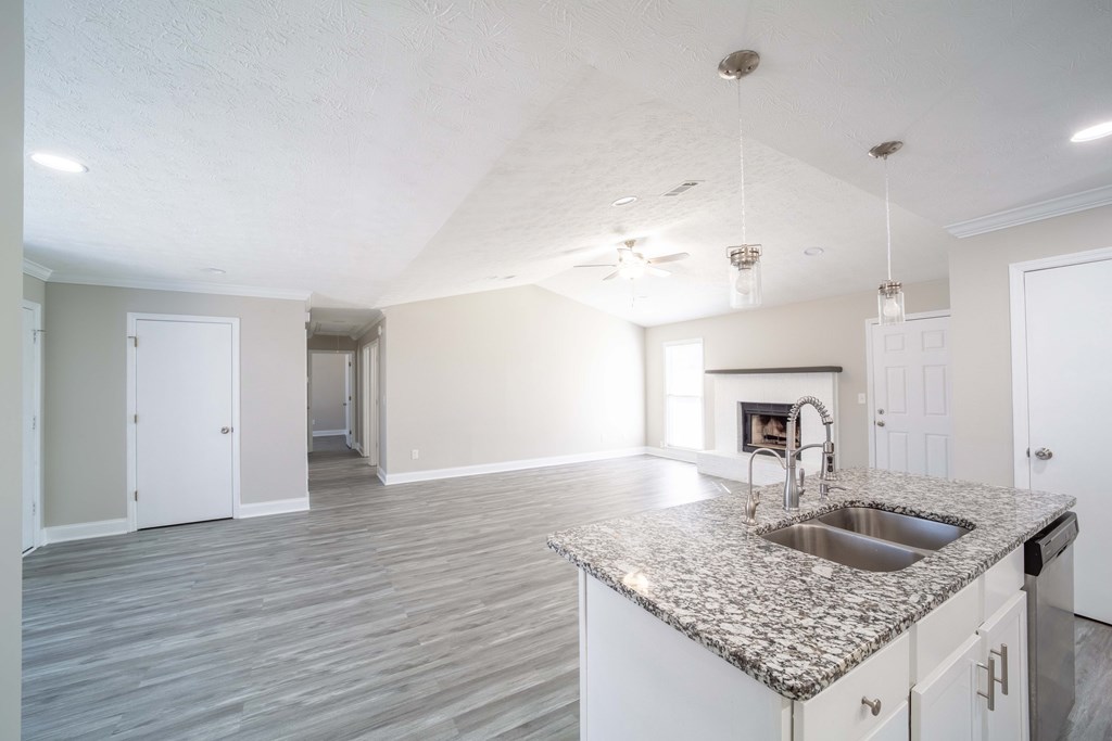 6308 Browning Drive Columbus, GA 31907 - Photo 9 of 19 a kitchen with granite countertop a sink and a stove
