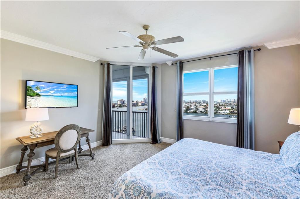 410 Flagship Drive, Unit 903 Naples, FL 34108 - Photo 14 of 29 a bedroom with a bed and a window