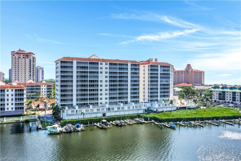 410 Flagship Drive, Unit 903 Naples, FL 34108 - Photo 22 of 29 a front view of a building with a lake view