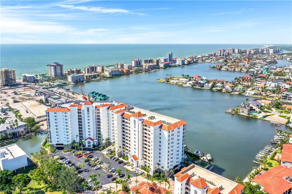 410 Flagship Drive, Unit 903 Naples, FL 34108 - Photo 23 of 29 an aerial view of ocean and residential houses with outdoor space