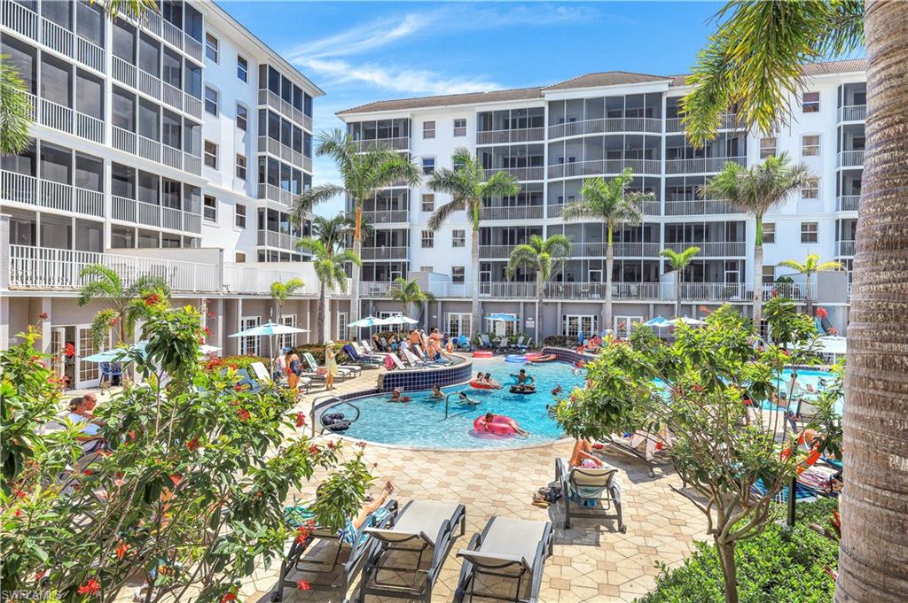 410 Flagship Drive, Unit 903 Naples, FL 34108 - Photo 24 of 29 a view of a patio with table and chairs and potted plants