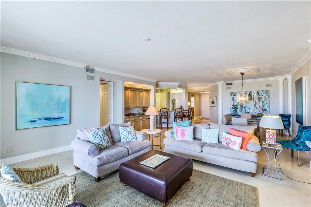 410 Flagship Drive, Unit 903 Naples, FL 34108 - Photo 6 of 29 a living room with furniture and a large window