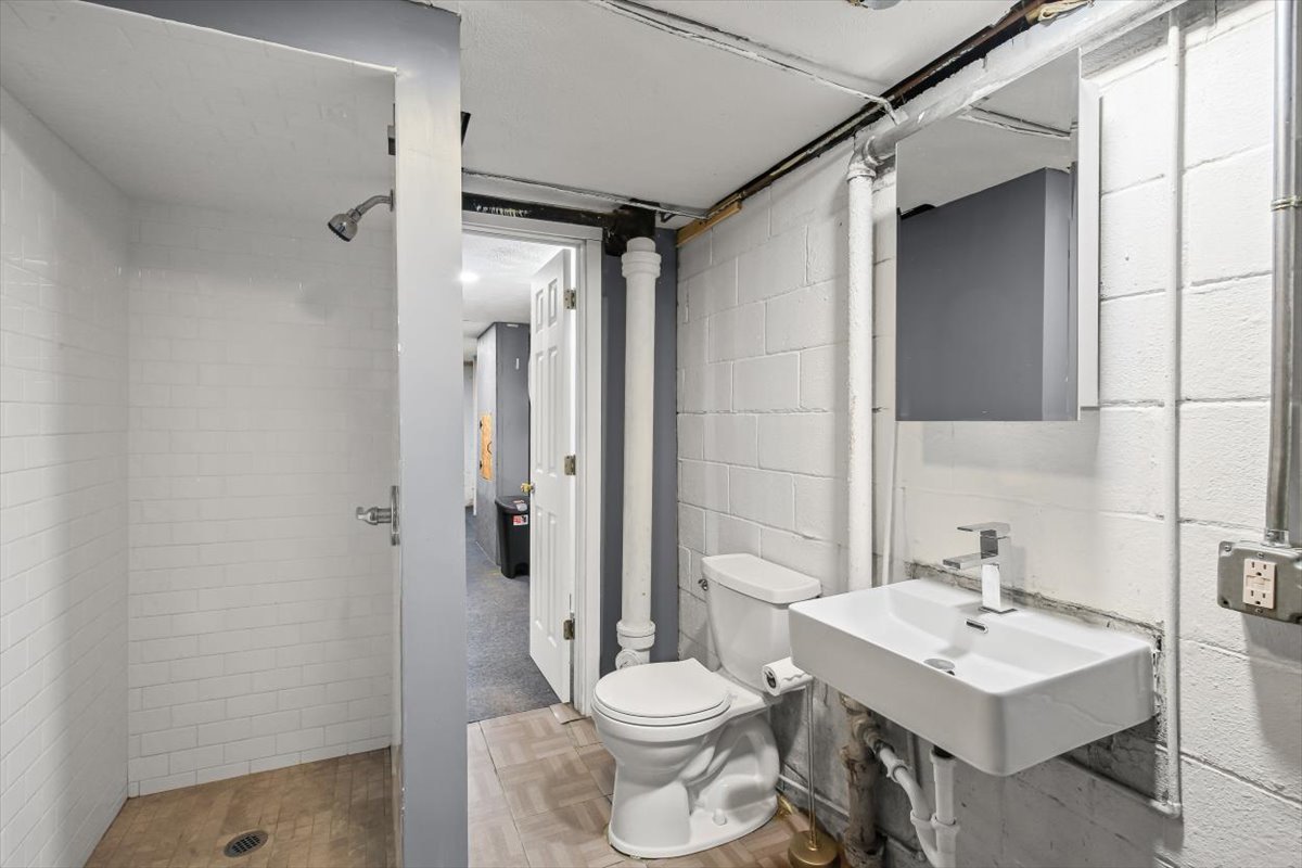 8 University Court Normal, IL 61761 - Photo 12 of 19 a bathroom with a sink toilet and shower