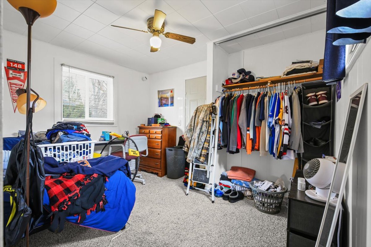 8 University Court Normal, IL 61761 - Photo 19 of 19 a view of walk in closet with clothes and shoes