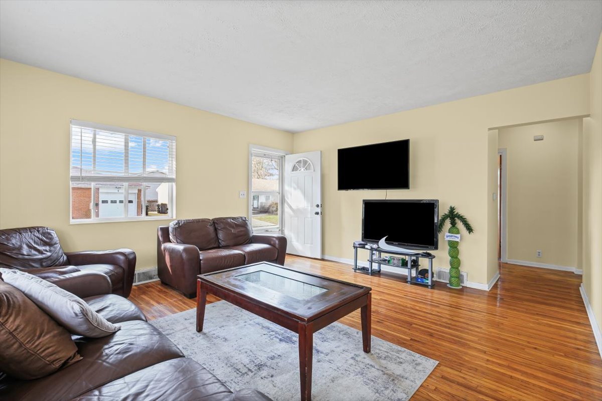 8 University Court Normal, IL 61761 - Photo 3 of 19 a living room with furniture and a flat screen tv
