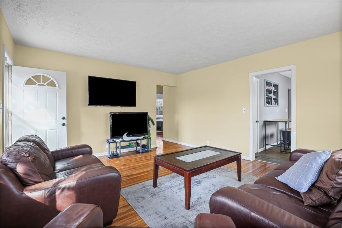 8 University Court Normal, IL 61761 - Photo 4 of 19 a living room with furniture and a flat screen tv