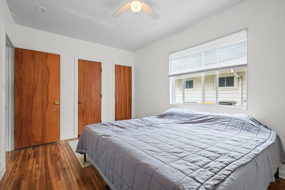 8 University Court Normal, IL 61761 - Photo 7 of 19 a bedroom with a bed and a dresser